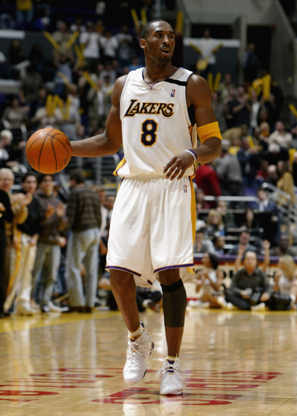 Kobe Bryant wearing number 8 jersey and Air Jordan Retro VIII PE
