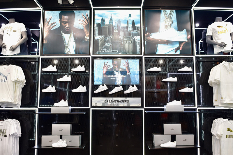 Meek Mill Watches the 76ers In a Louis Vuitton x Nike & Amiri x Chemist Fit