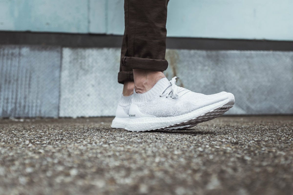 ultra boost uncaged triple white on feet