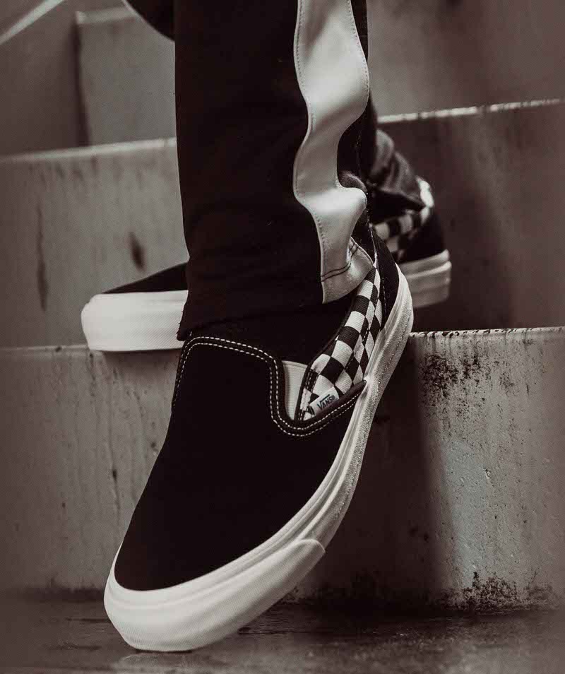 vans classic slip on black on feet