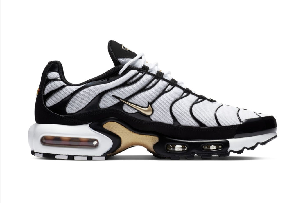 white and black air max plus