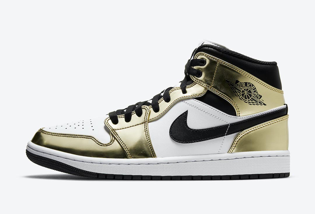 gold and white air jordans