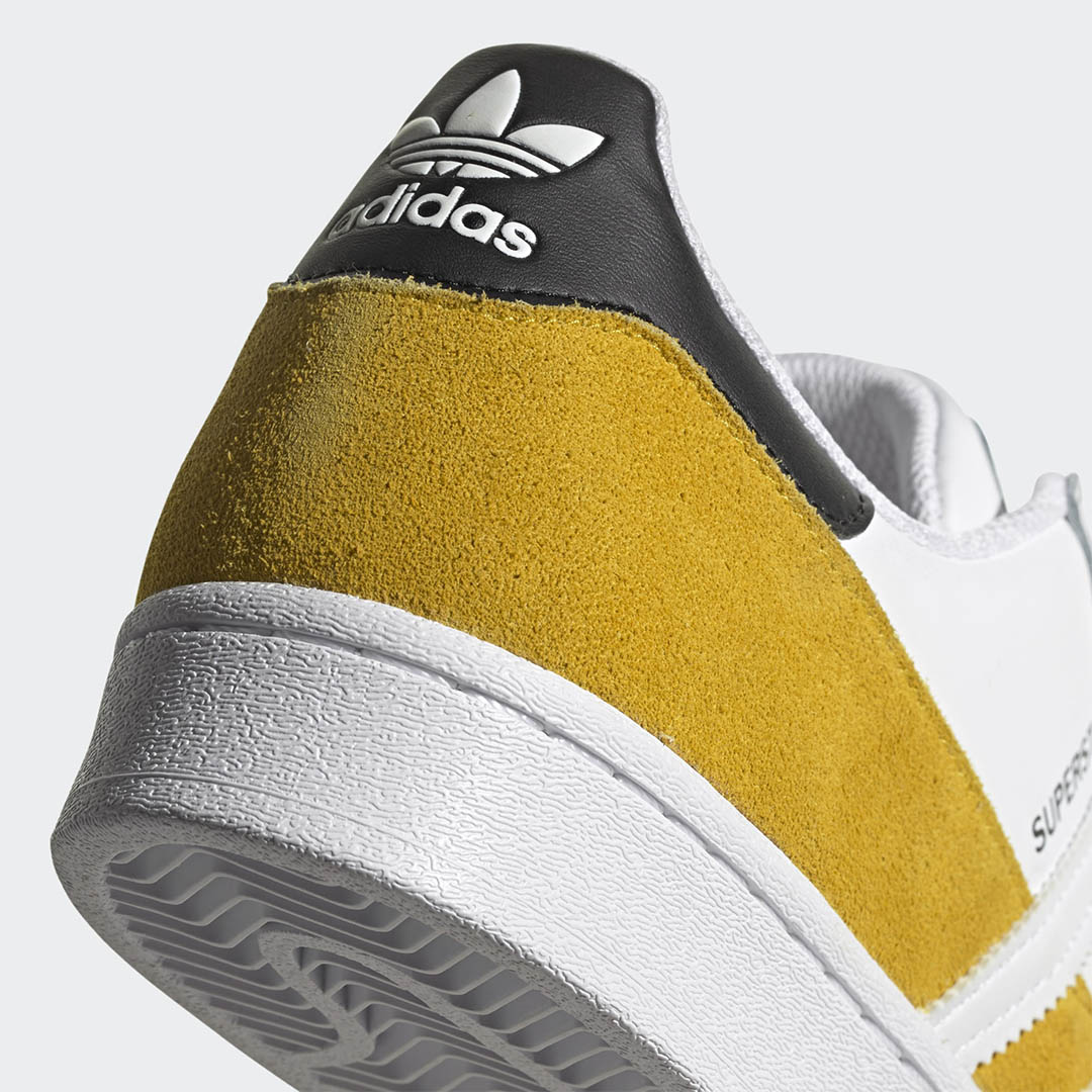 yellow adidas superstars