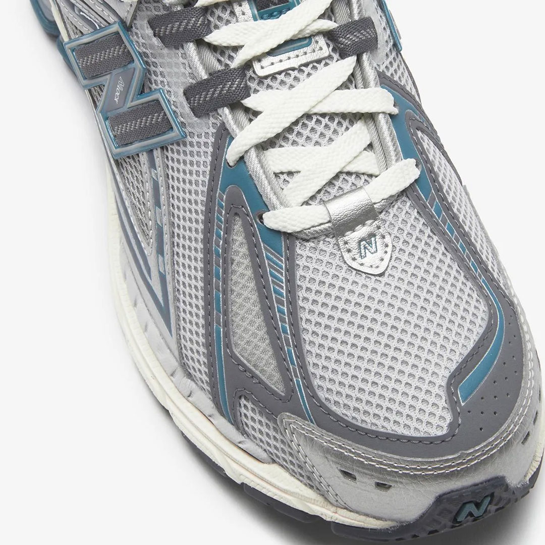 New Balance branding on heel "Silver/Teal" M1906REO